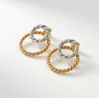 Dual Tone Infinity Ohrringe 18KGP: goldene und silberne verdrillte Kreise im Infinity-Design.